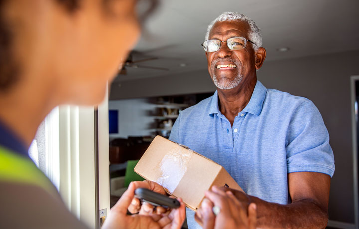 Man recieving pharmacy package